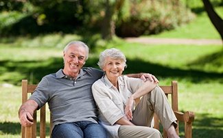 senior couple sitting on bench